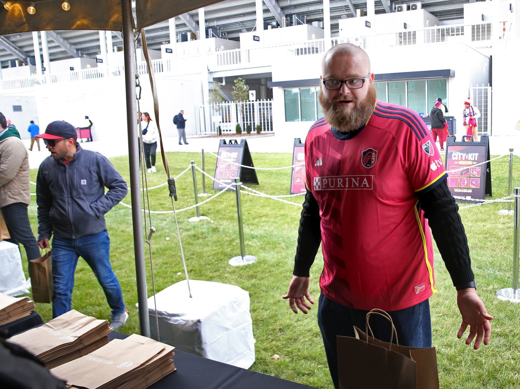 Fans pickup jerseys before warmup game at CityPark stadium